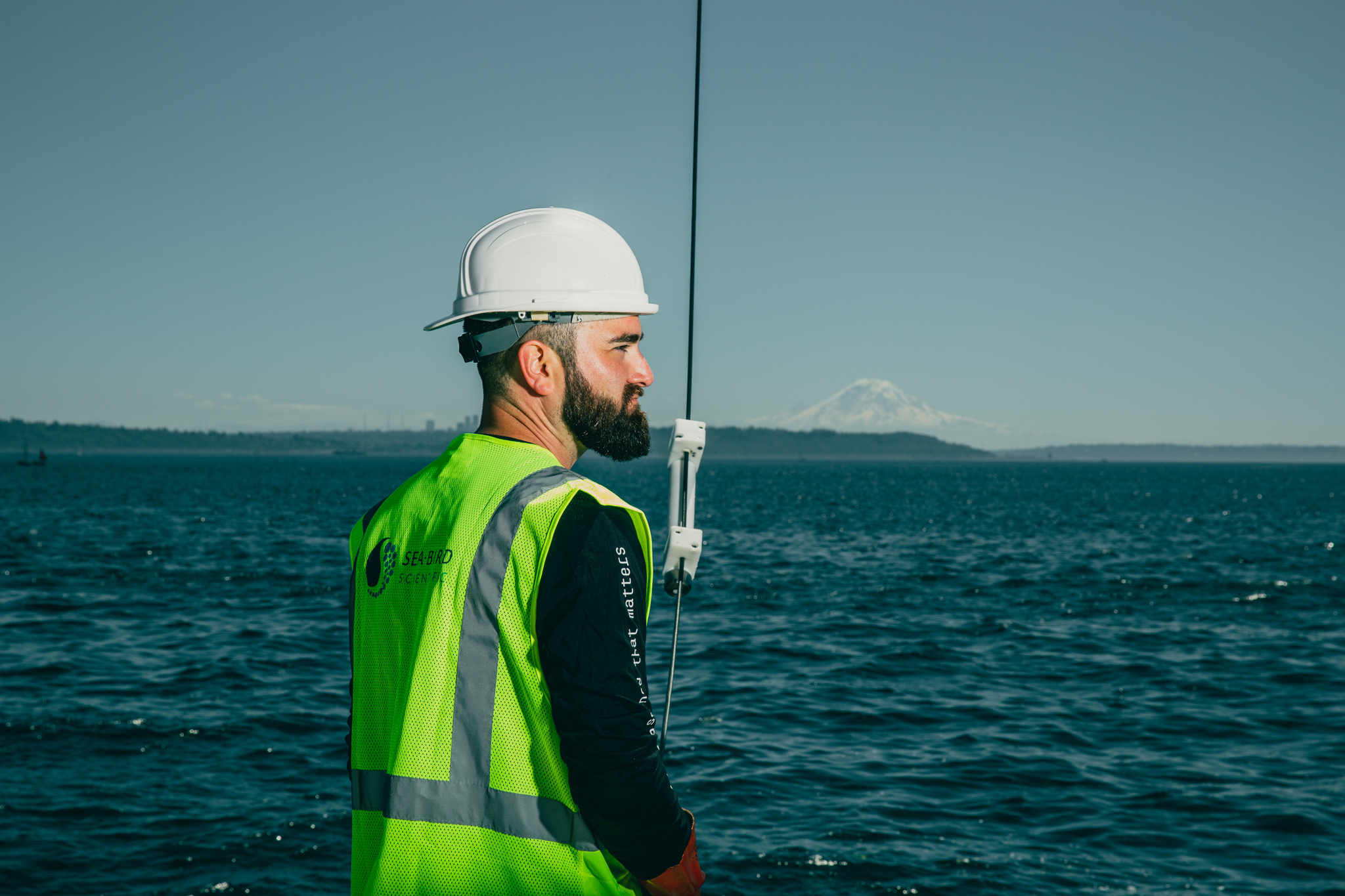 Oceanographer deploying CTD for biogeochemical monitoring