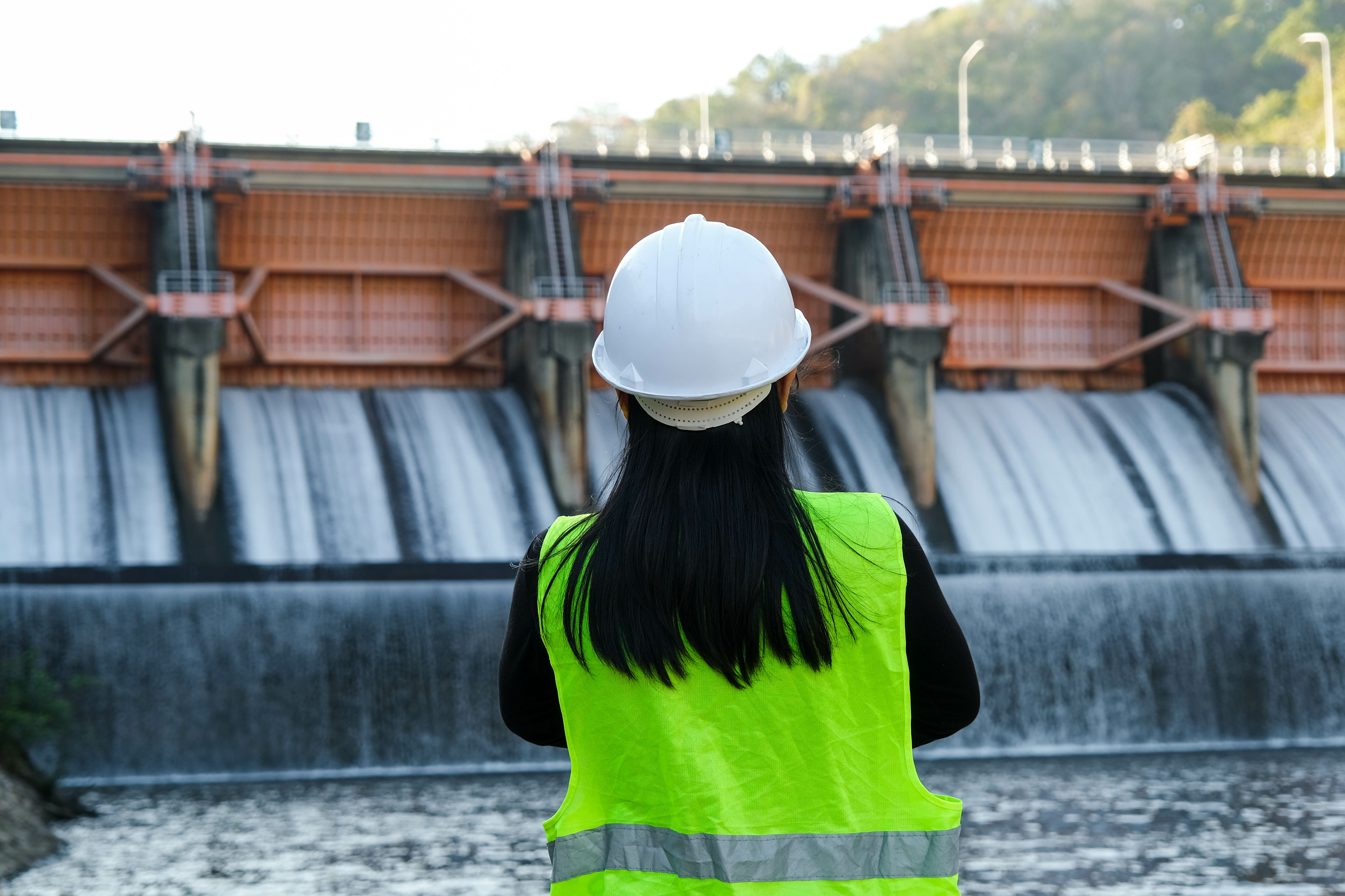 Woman assessing dam water quality