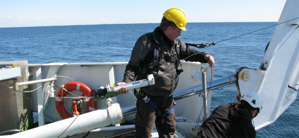 Scientist on a boat using a Inductive Modem Module