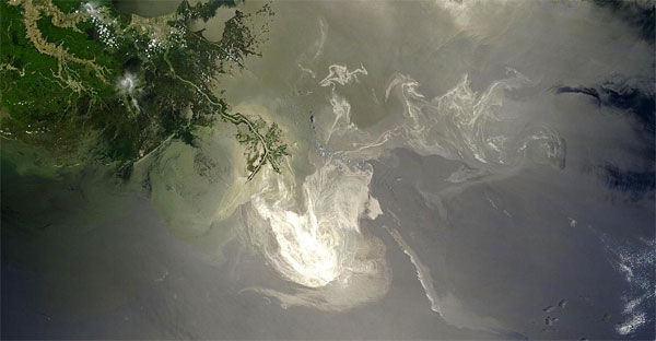 An aerial view of an oil spill in water